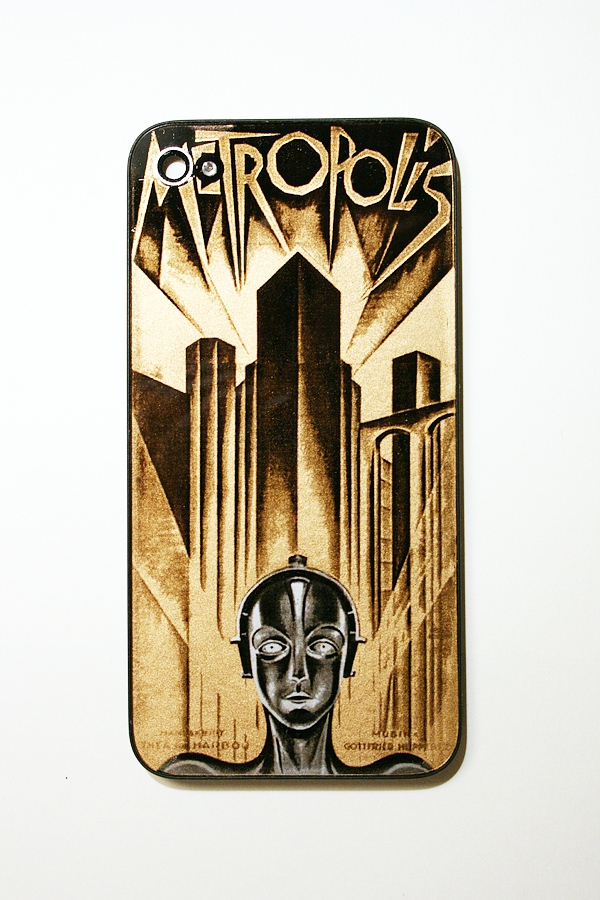 gold, silver, and black iphone back glass